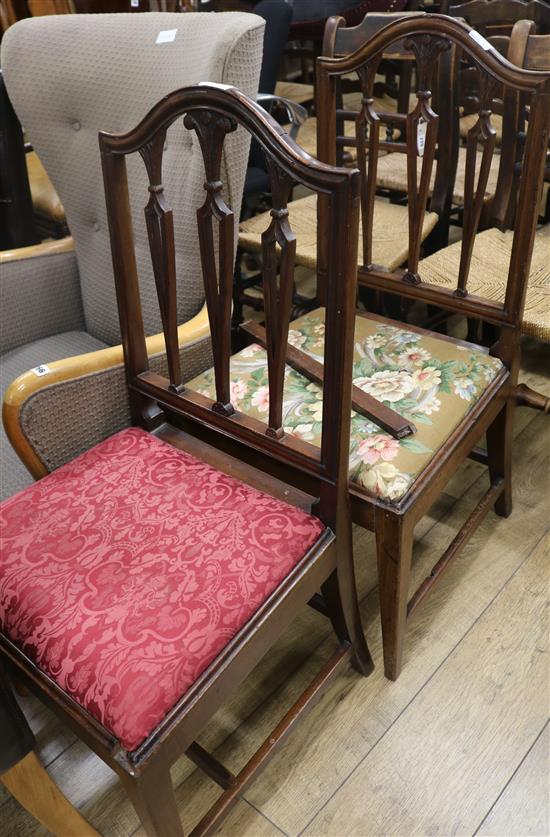 Two George III Hepplewhite style mahogany dining chairs, the spars carved with Prince of Wales plumes